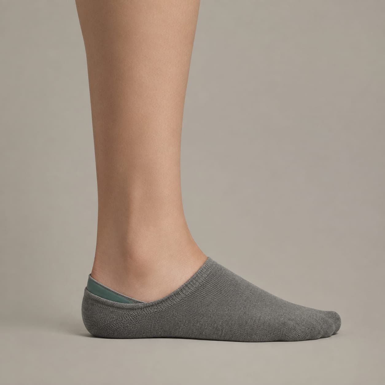 Deep Premium worn on a foot, seen from the side, with the cuff edge visible above the heel.