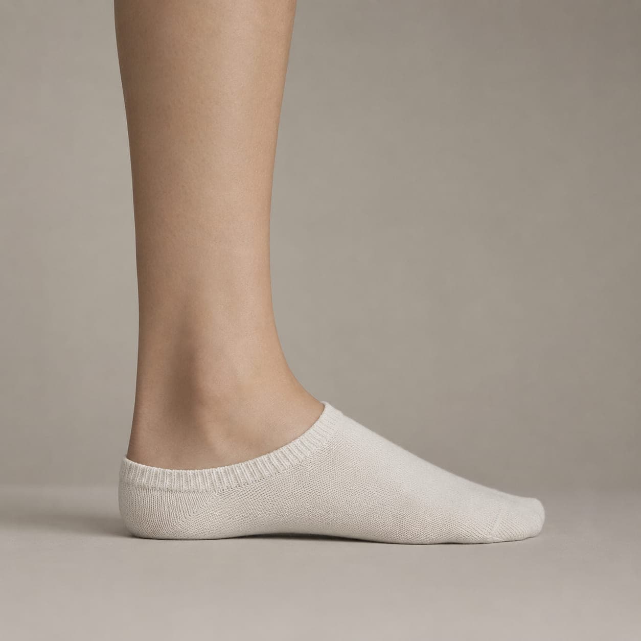 Boat 46 worn on a foot, seen from the side, with the cuff edge visible above the heel.