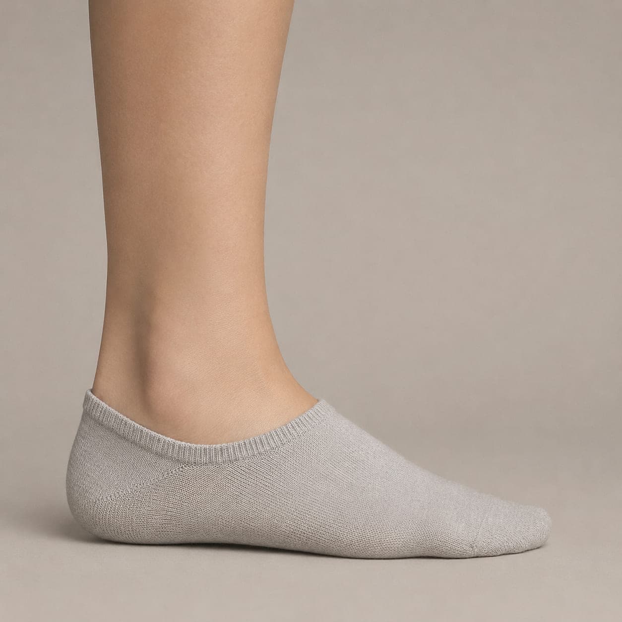 Boat 58 worn on a foot, seen from the side, with the cuff edge visible above the heel.
