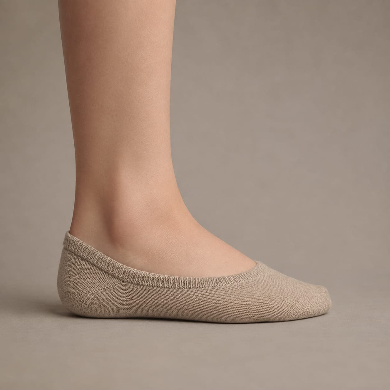 Band 38 Deep-Heel worn on a foot, seen from the side, with the cuff edge visible above the heel.