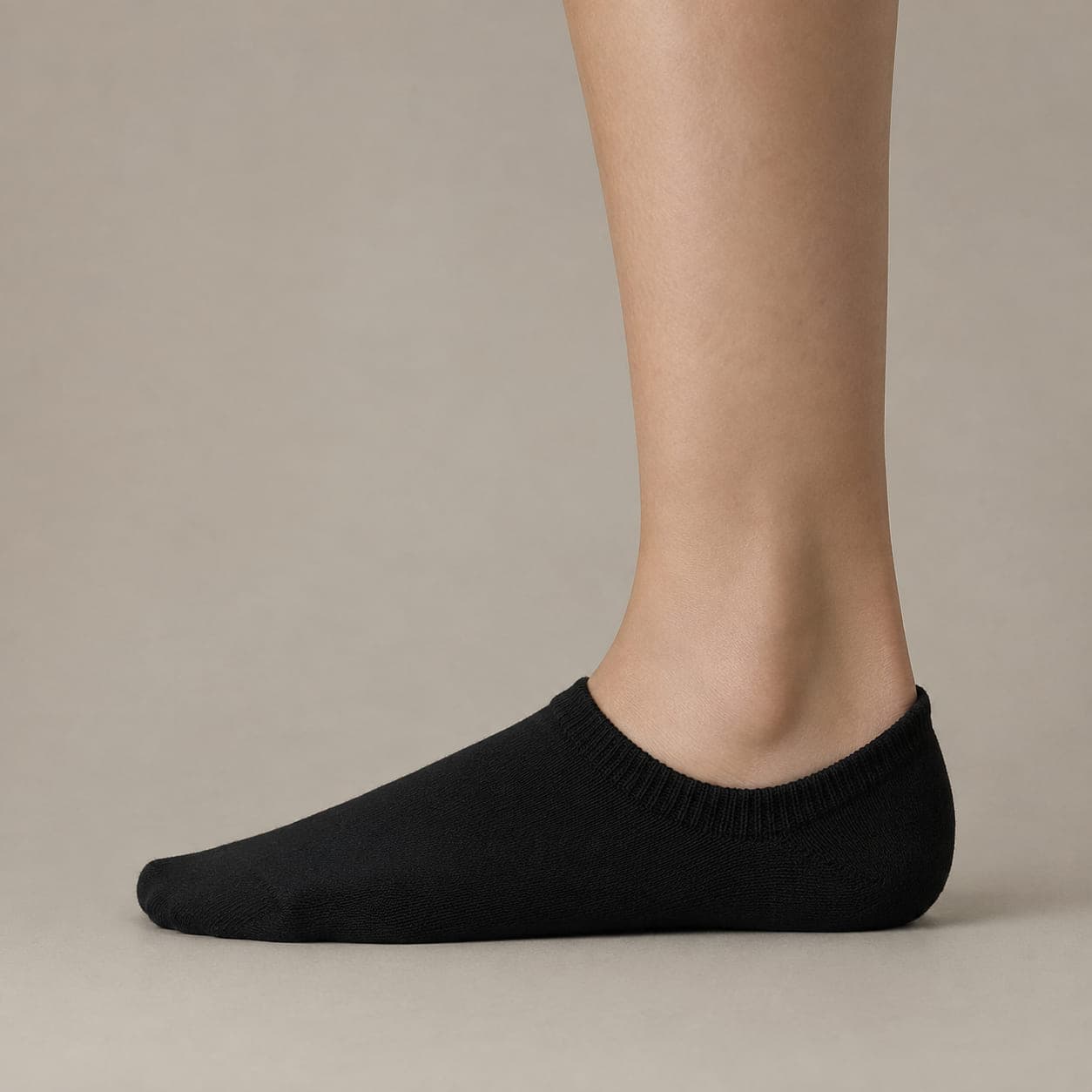 Band Premium worn on a foot, seen from the side, with the cuff edge visible above the heel.